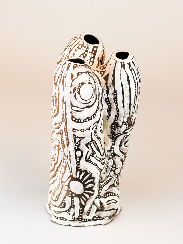 photograph of earthen ceramic sculpture, hand painted with patterns, front view, thumbnail