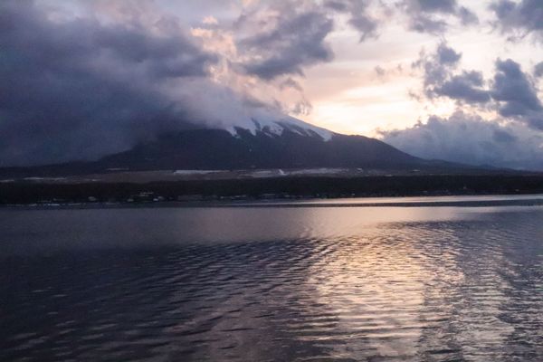 Mt fuji covered by clouds, sun light shinning through, Lake view, thumbnail