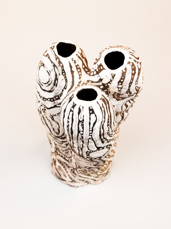 photograph of earthen ceramic sculpture, hand painted with patterns, aerial view, thumbnail